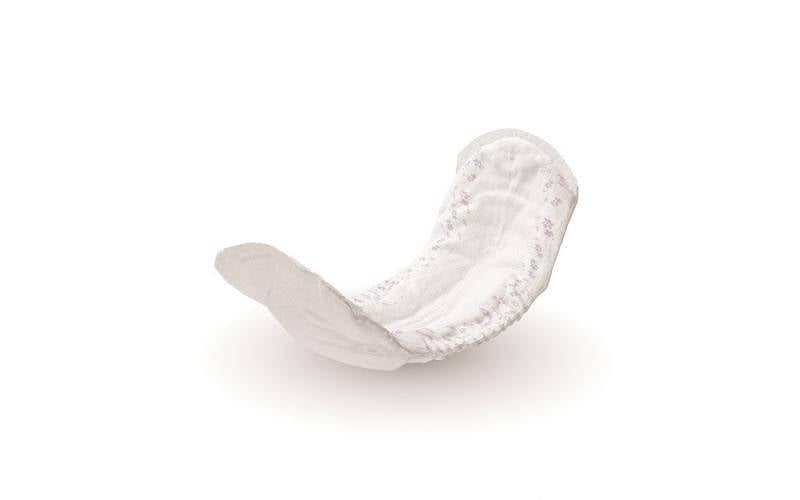 Incontinence pad with central adhesive strip on the outside
